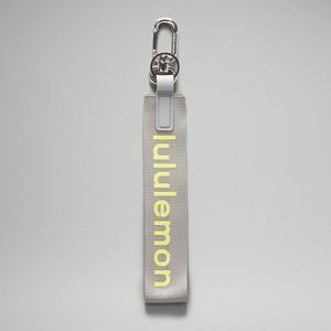 Lululemon Never Lost Keychain, Rhino Grey/Electric Lemon- NWT